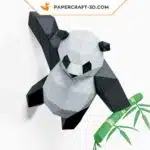 Papercraft Panda grimpant sur un mur en origami papier 3D