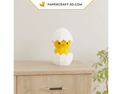 Papercraft chick in an egg in 3D origami
