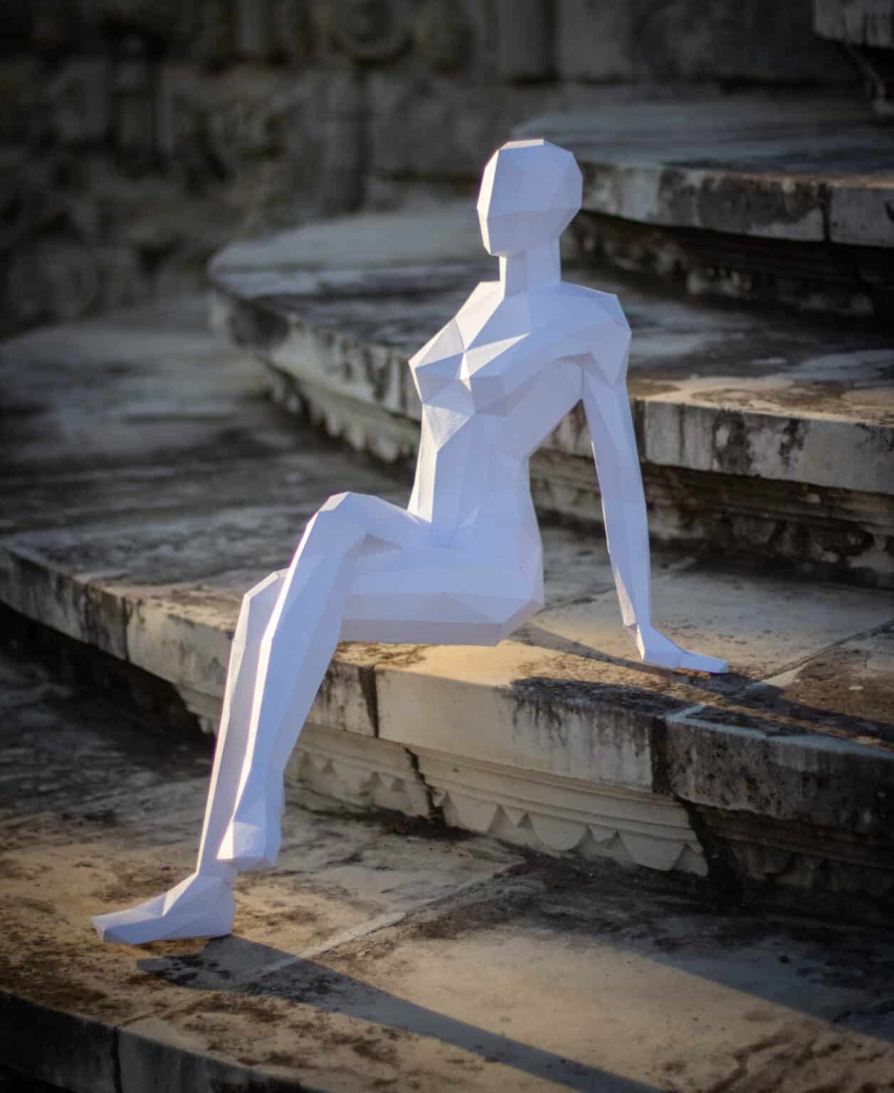 Papercraft de mulher sentada em origami 3D